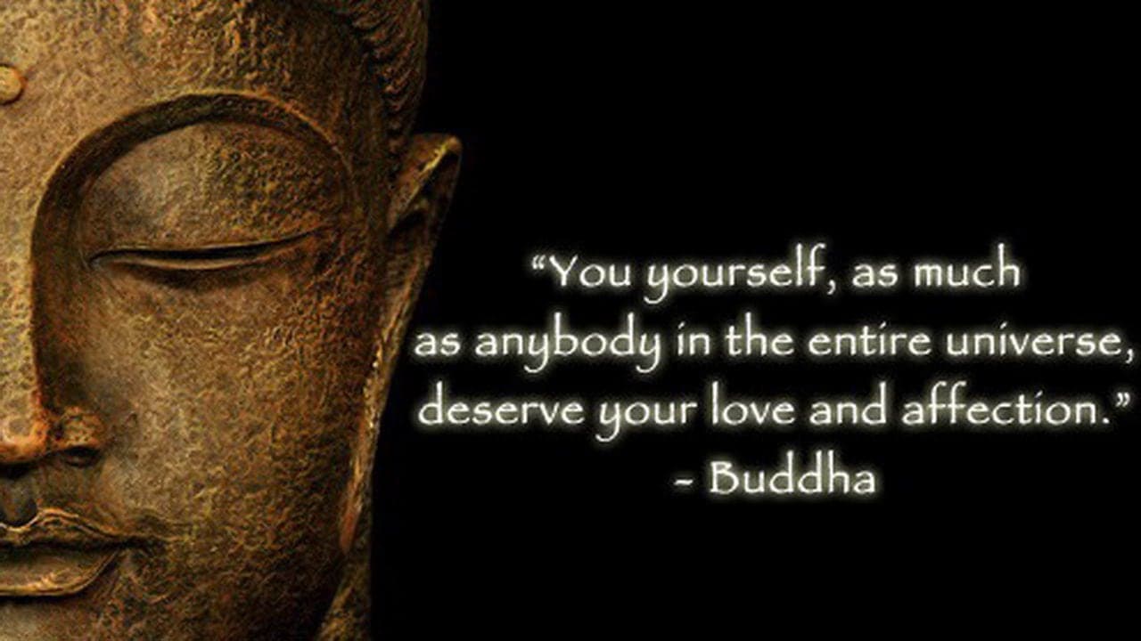 Close-up of a serene Buddha statue with an inspiring quote about self-love and affection.