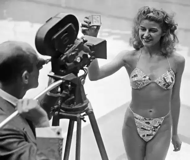 Micheline Bernardini modeling the first modern bikini made from newspaper print in 1946