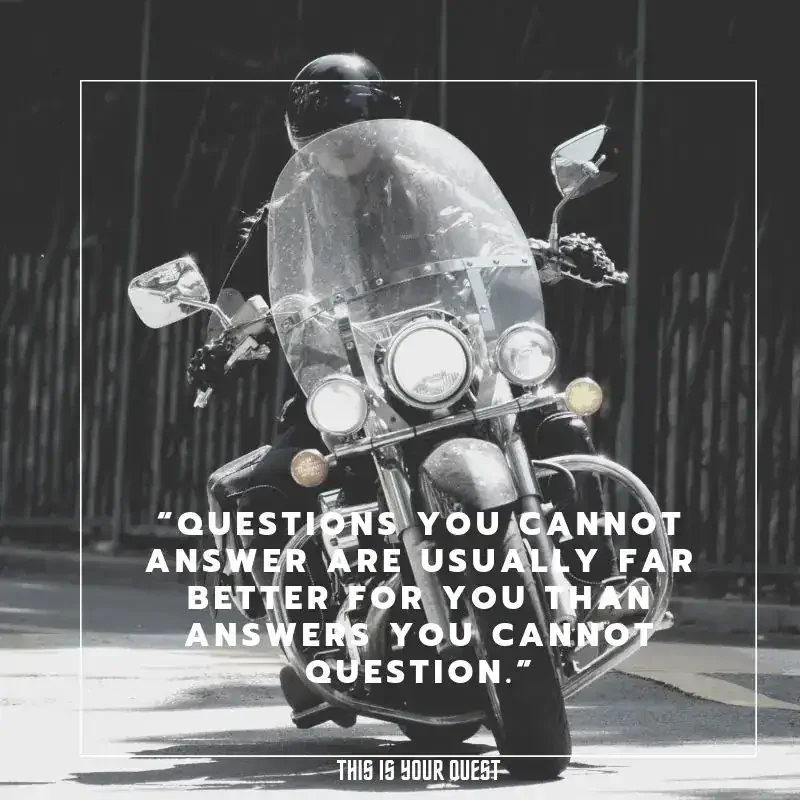 Biker facing forward with philosophical quote about questions and answers.